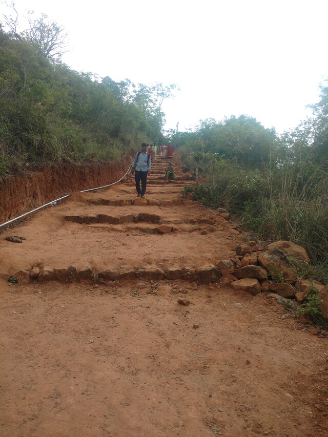 Trekking route to a temple in Sirumalai. It has a fairly good paved path making it easy to climb.